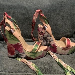 Beautiful flower detail wedge heels. Never worn.